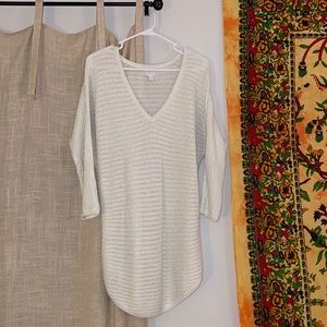 Long, white, v-neck “Soho” sweater with silver/sparkly thread. Size medium.